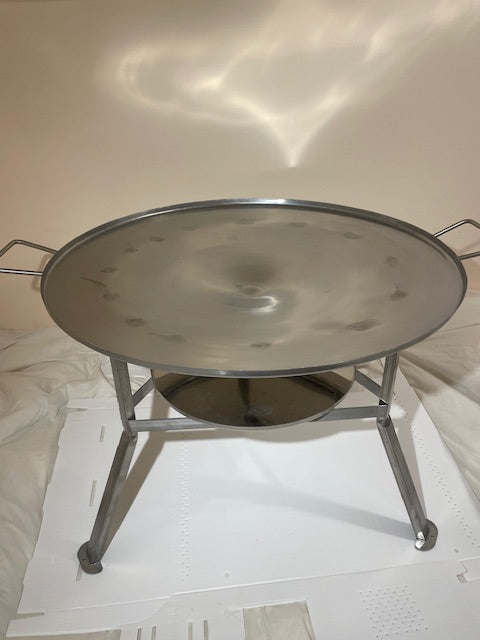 stainless steel round korean grill that can be used with open fire, charcoal, or propane.  Comes with lid and charcoal tray. Legs and handles.  Perfect for cabins, campsites, or any outdoor location.  There is a fire ban, no problem, can be easily used with propane fire.